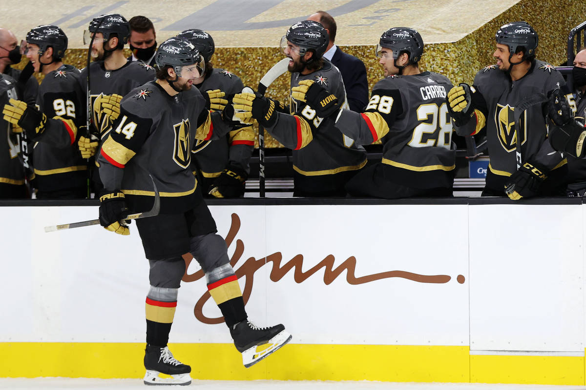 Vegas Golden Knights defenseman Nicolas Hague (14) celebrates a goal with his team during the f ...