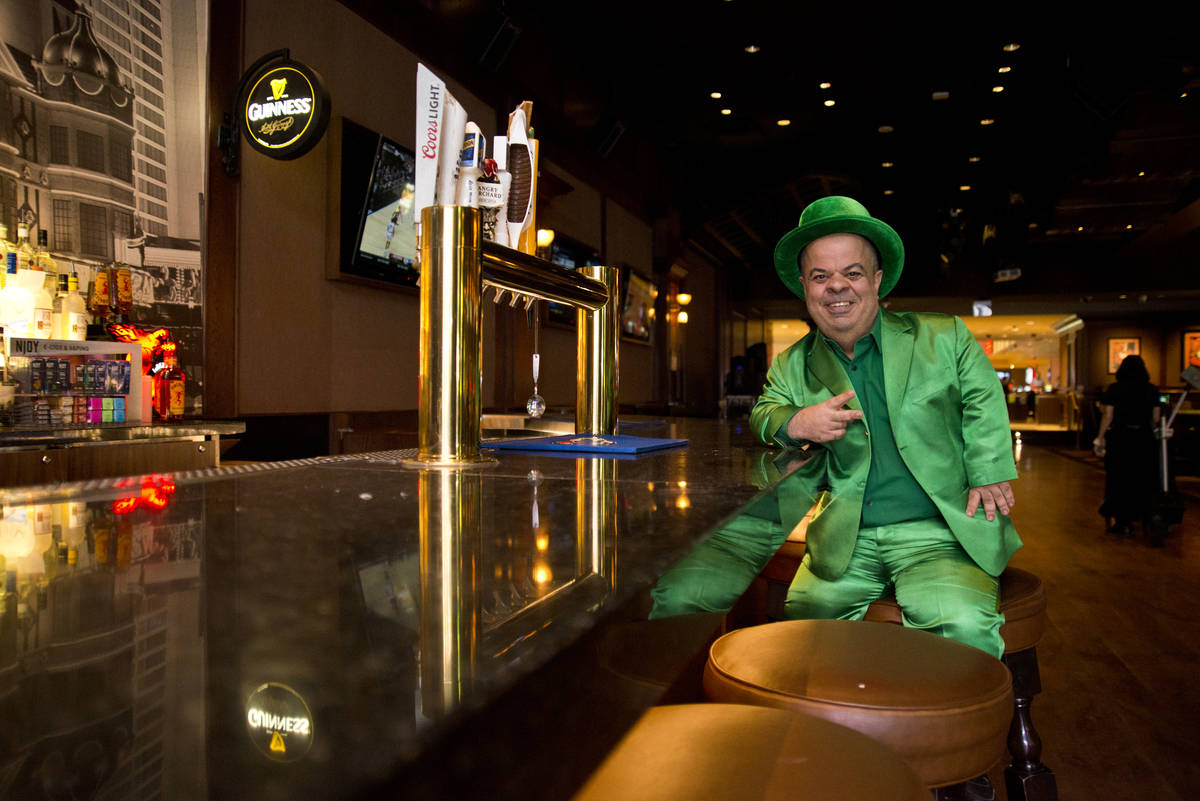 Brian Thomas, O'Sheas casino manager and resident leprechaun, poses for a photograph inside the ...