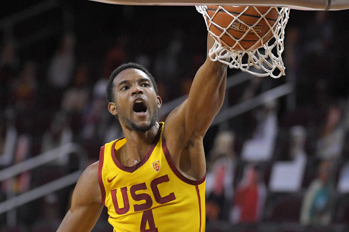 FILE - In this Feb. 17, 2021, file photo, Southern California forward Evan Mobley dunks during ...