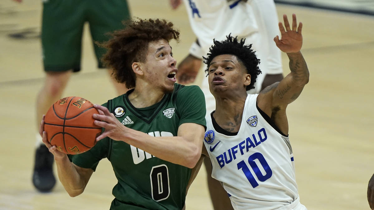 Ohio's Jason Preston (0) drives to the basket against Buffalo's Ronaldo Segu (10) during the fi ...