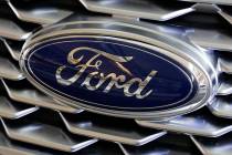A Feb. 15, 2018, file photo shows a Ford logo on the grill of a 2018 Ford Explorer on display a ...