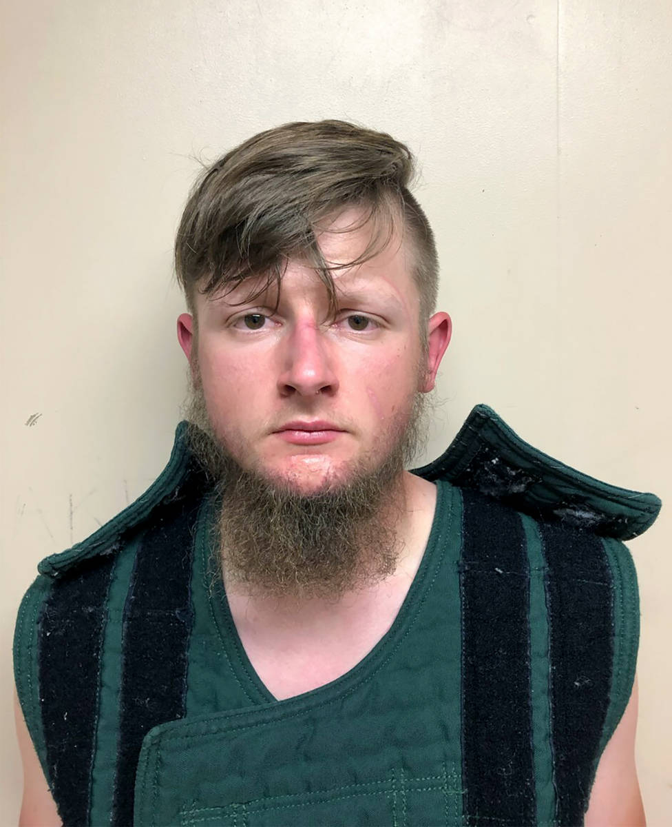 This booking photo provided by the Crisp County Sheriff's Office shows Robert Aaron Long on Tue ...