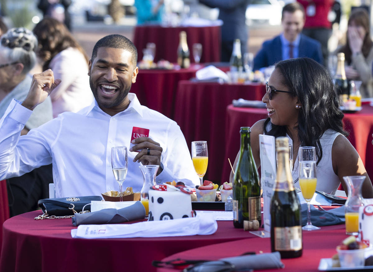 UNLV School of Medicine graduates Damien Medrano, left and his wife Lauren Hollifield react aft ...
