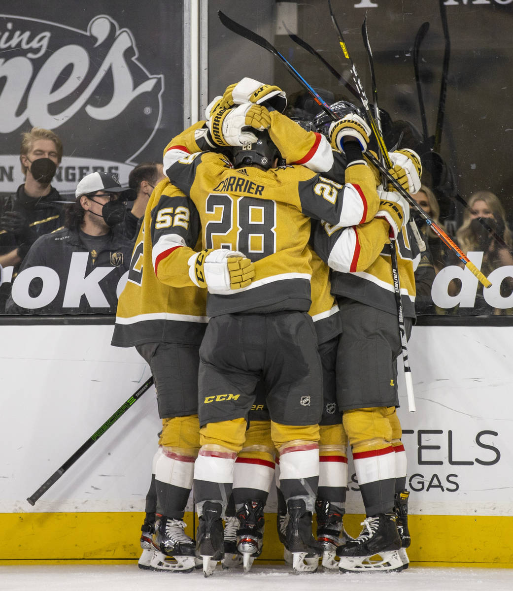 Golden Knights players celebrate a possible goal over San Jose Sharks goaltender Devan Dubnyk ( ...