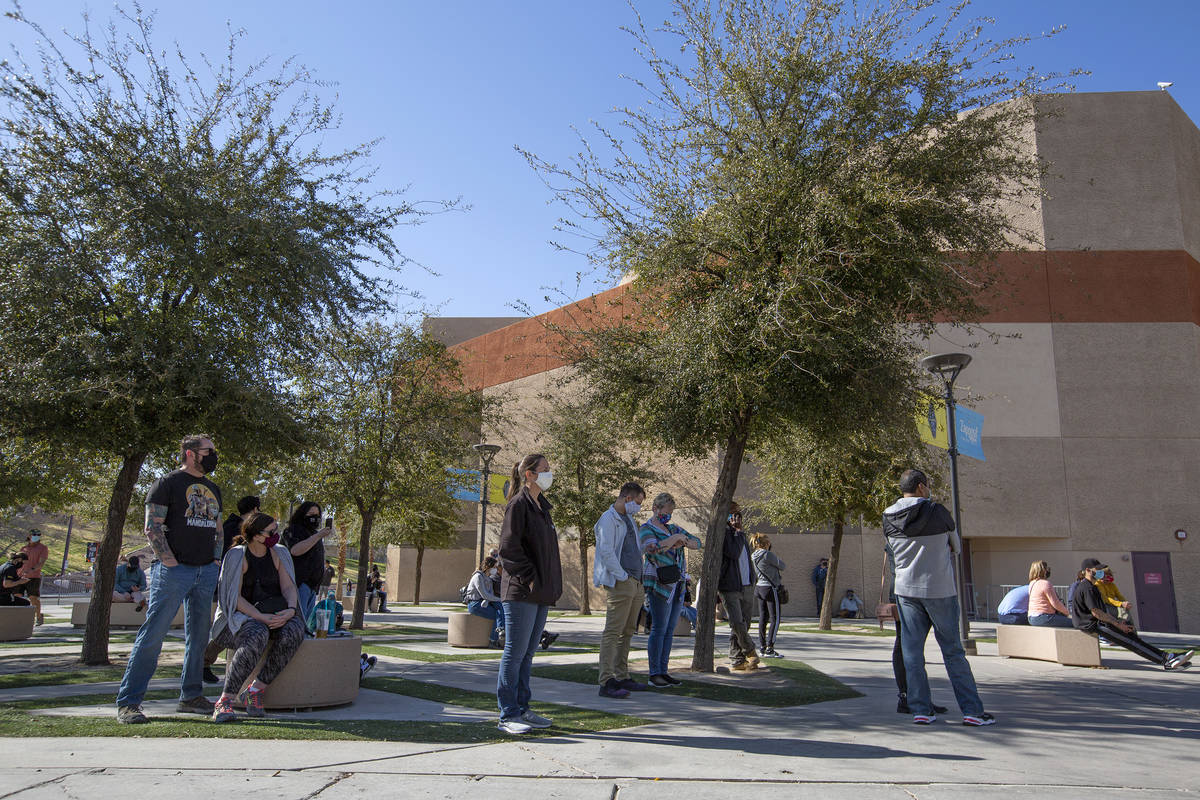 People wait to be called from a standby list for a COVID-19 vaccine at Cashman Field on Tuesday ...