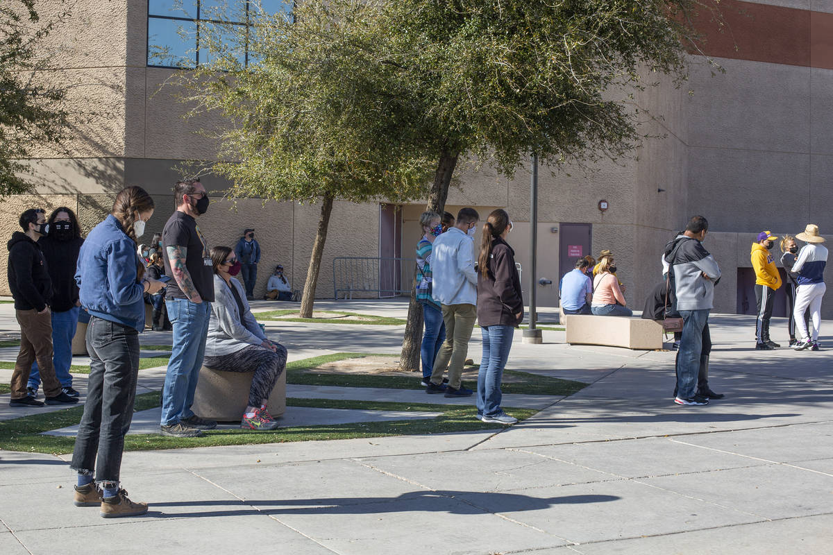 People wait to be called from a standby list for a COVID-19 vaccine at Cashman Field on Tuesday ...