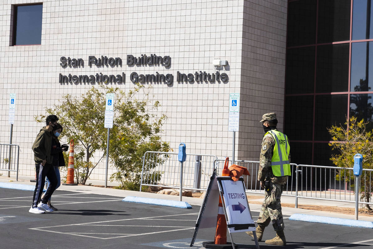 People arrive at a COVID-19 testing center at the Stan Fulton Building, on Wednesday, March 17, ...