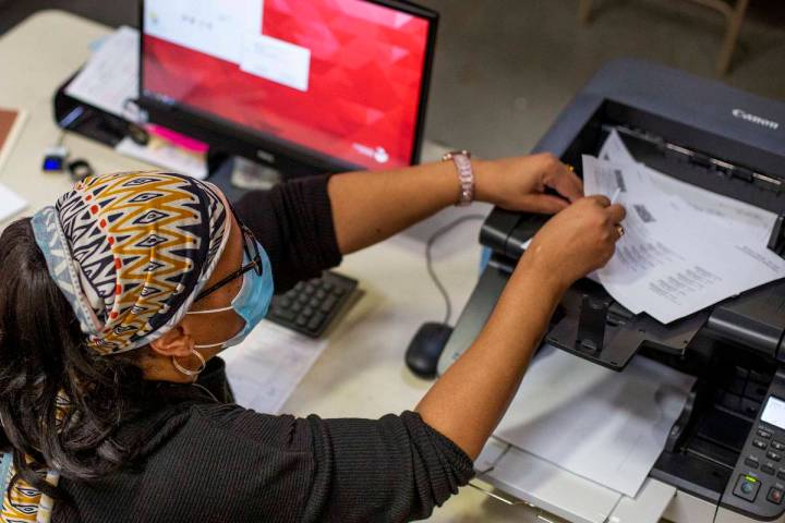 Mail-in ballots are counted at Clark County Election Center on Wednesday, Nov. 4, 2020, in Las ...