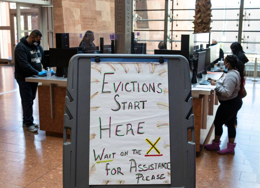 Tenants who received an eviction notice from their landlord fill out forms at the Civil Law Sel ...