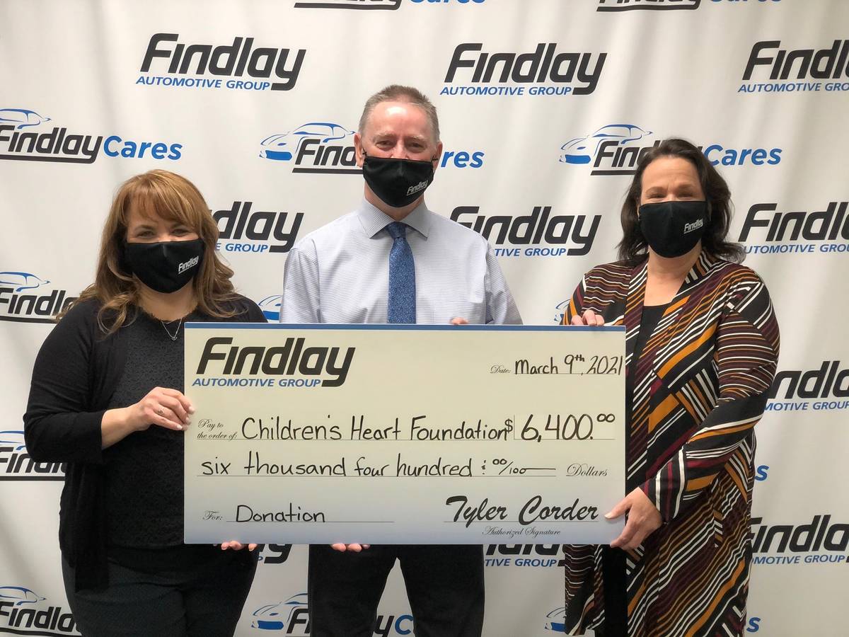 Tyler Corder, CFO of Findlay Automotive, is flanked by Melissa Cipriano, left, executive direct ...