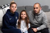 Tiffany Hemberger, Billy Hemberger and their daughter Sydney Hemberger pose for a portrait afte ...