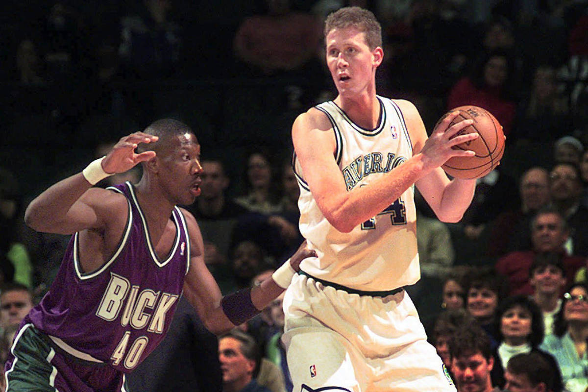 FILE- In this Nov. 22, 1997, file photo, Dallas Mavericks' Shawn Bradley (44) looks to pass as ...