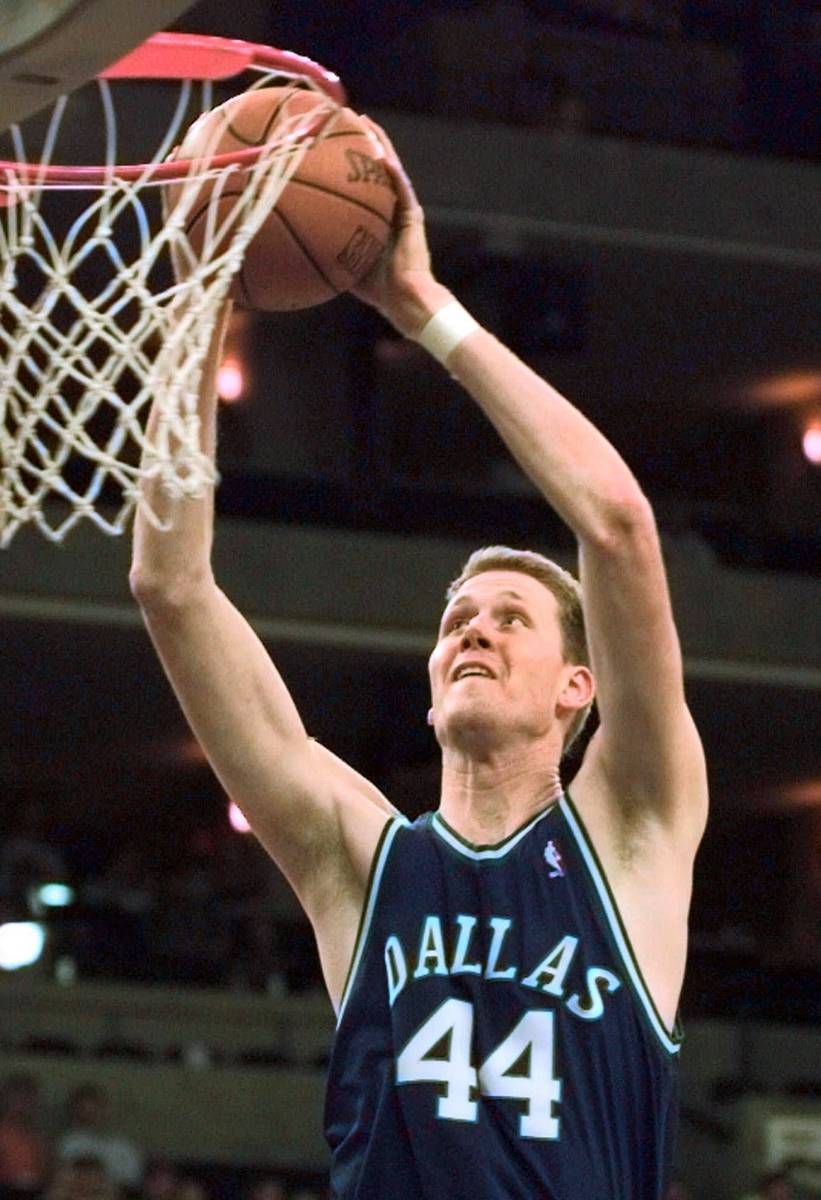 FILE- In this April 16, 1998, file photo, Dallas Mavericks' Shawn Bradley goes up for a basket ...