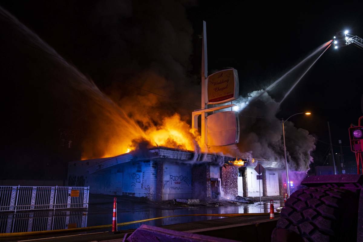Las Vegas firefighters battle flames engulfing a vacant wedding chapel at 1431 S. Las Vegas Blv ...