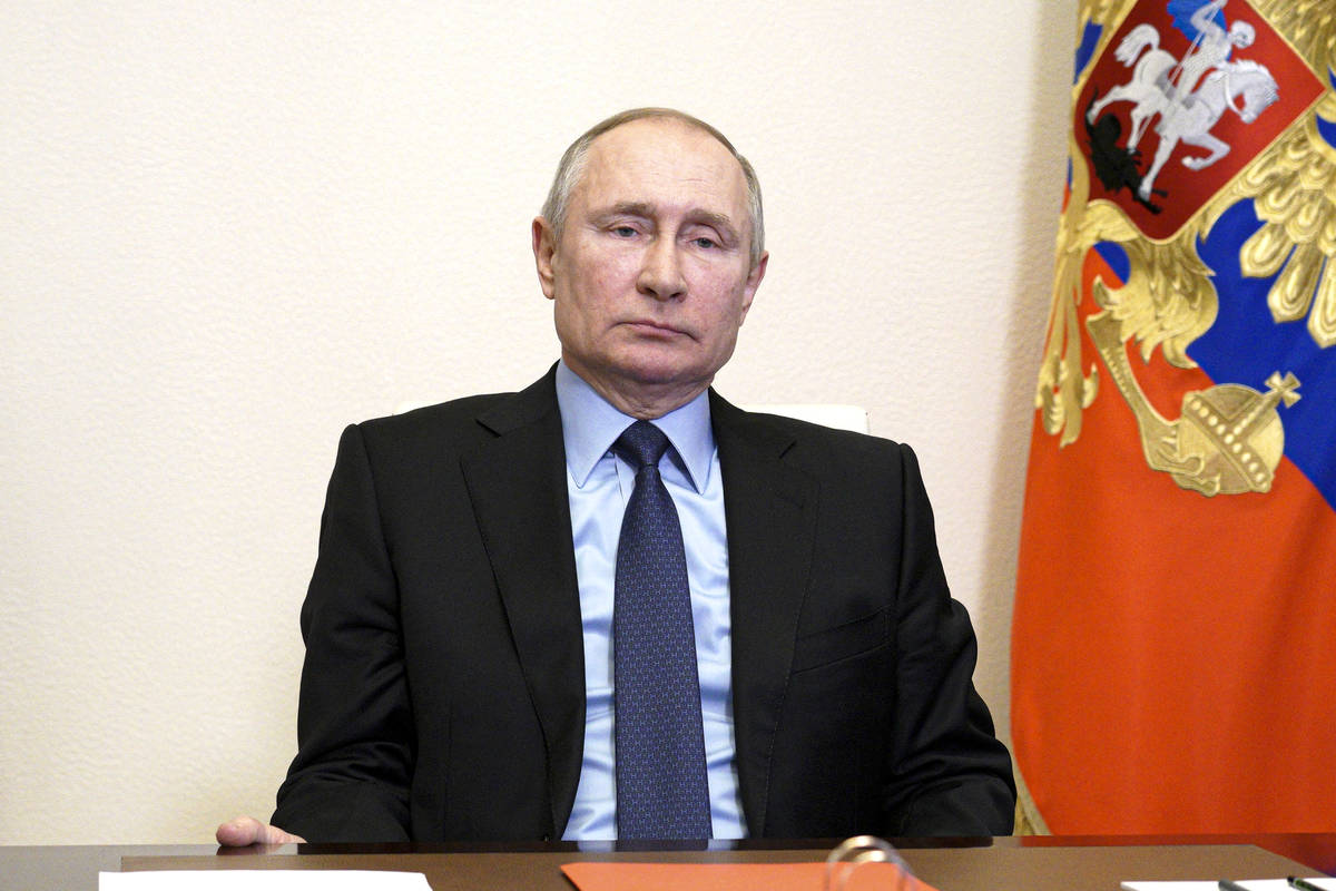 Russian President Vladimir Putin chairs a Security Council meeting via video conference at the ...