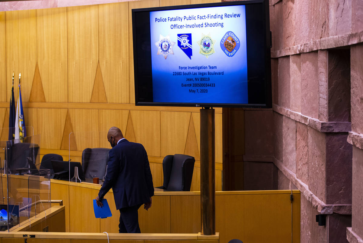 Defense attorney Carl Arnold returns to his seat after speaking to family members of James Peas ...