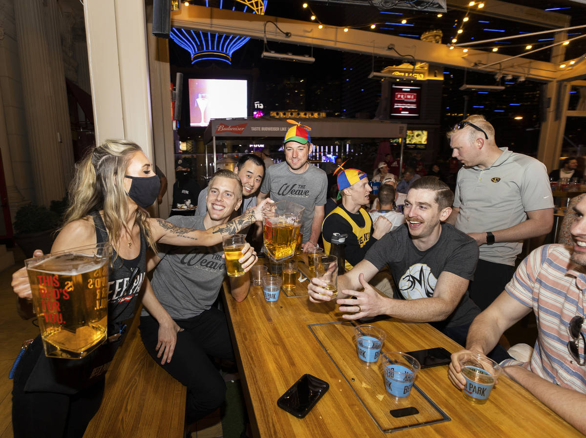 Guests celebrate fresh pitchers of beer at Beer Park on March 19, in Las Vegas. (Benjamin Hager ...