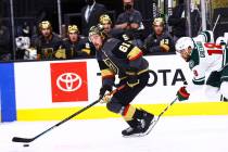Golden Knights right wing Mark Stone (61) skates with the puck past Minnesota Wild left wing Jo ...