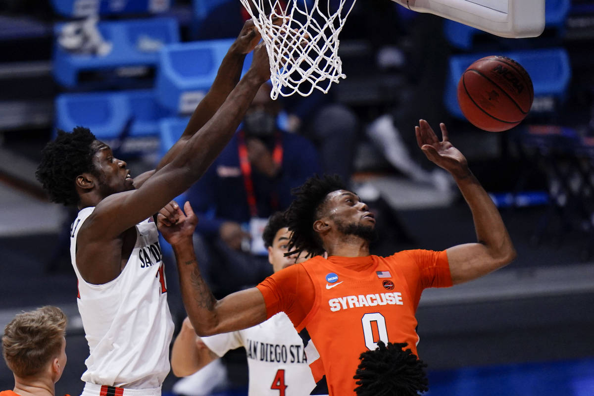 Syracuse forward Alan Griffin (0) tries to save a rebound in front of San Diego State forward N ...