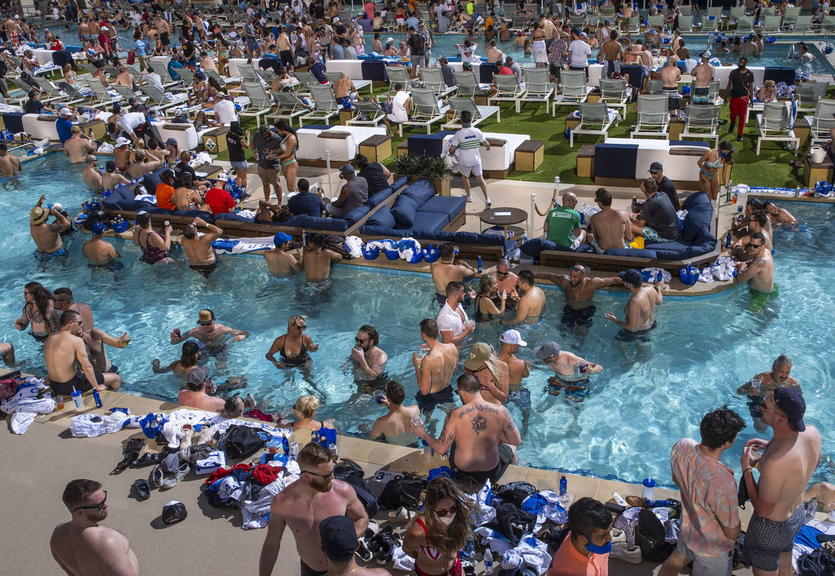 The pools and decks are crowded in Stadium Swim at the Circa on Friday, March 19, 2021. (L.E. ...