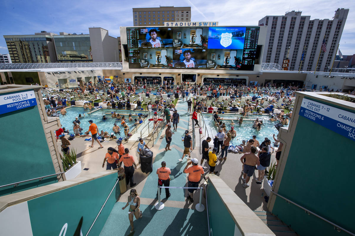 The pools and decks are crowded at Stadium Swim as March Madness is