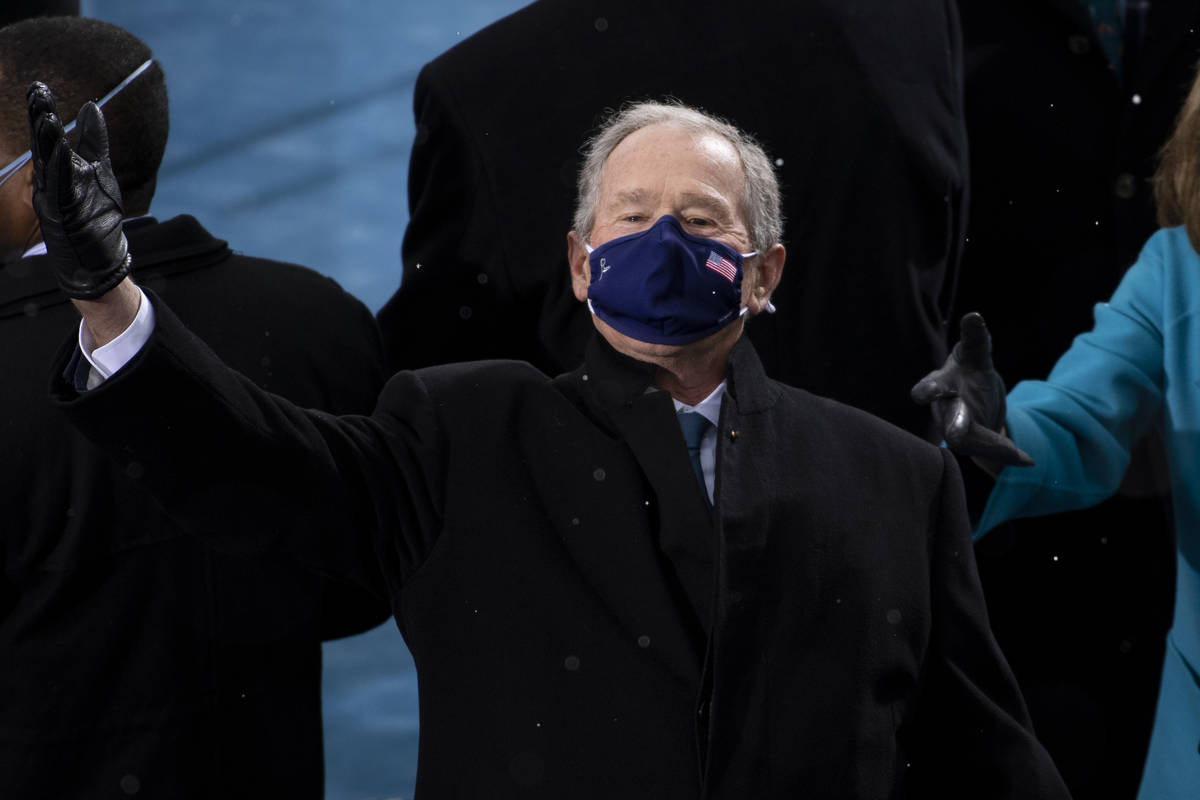 Former President George W. Bush arrives at the 59th Presidential Inauguration at the U.S. Capit ...