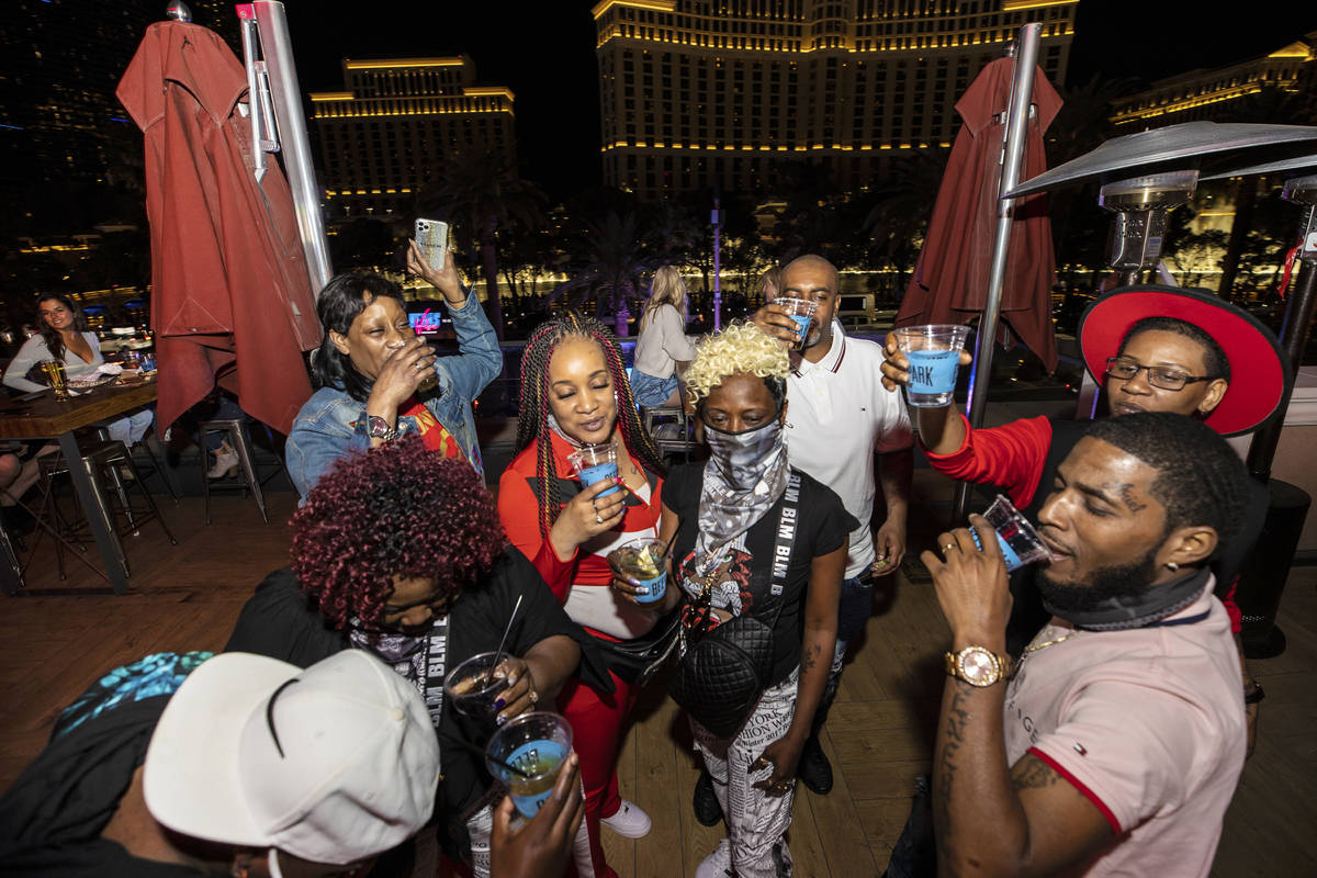 Guests enjoy cocktails at Beer Park on Friday, March 19, 2021, in Las Vegas. (Benjamin Hager/La ...