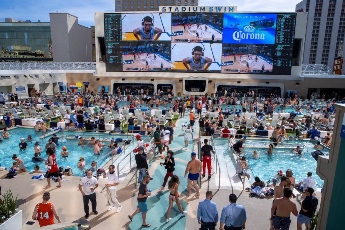 The pools and decks are crowded in Stadium Swim at the Circa on Friday, March 19, 2021. (L.E. B ...