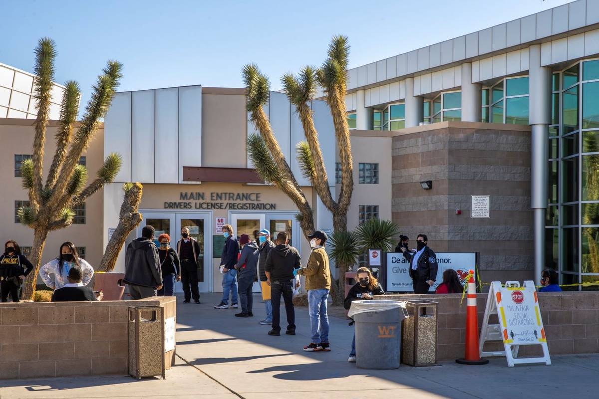 People wait outside the Nevada Department of Motor Vehicles building on West Flamingo Road in D ...