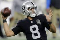 Las Vegas Raiders quarterback Marcus Mariota (8) looks to pass against the Los Angeles Chargers ...