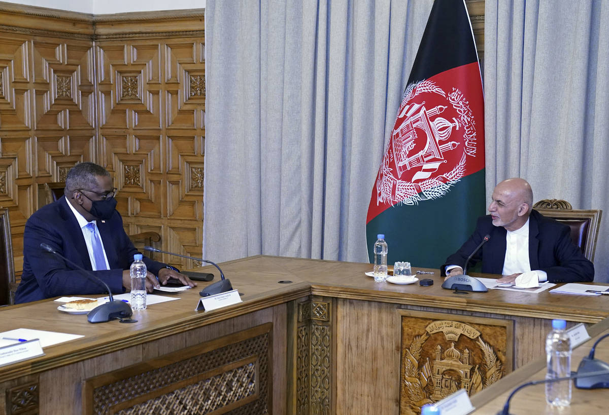 U.S. Defense Secretary Lloyd Austin, left, meets Afgan President Ashraf Ghani at the presidenti ...