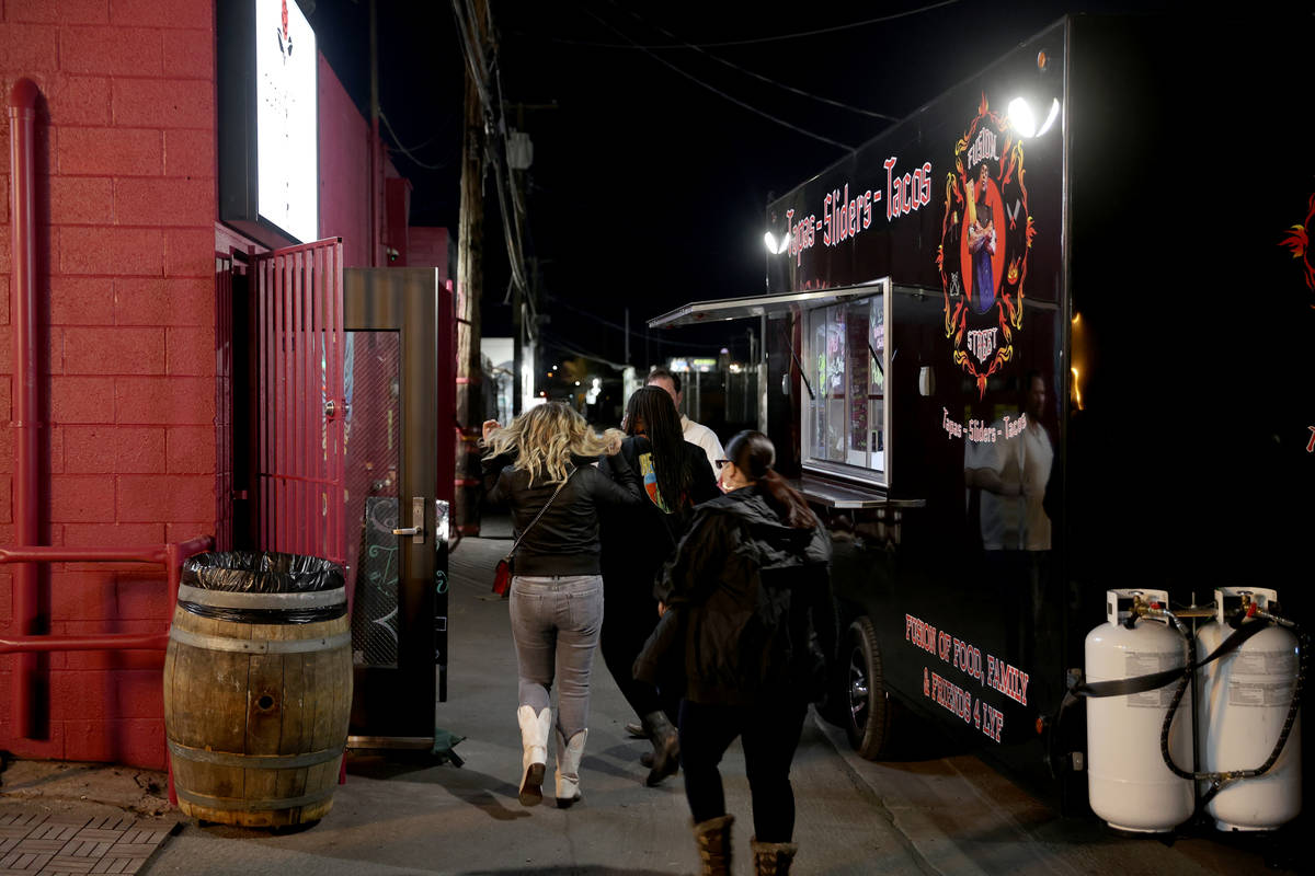 People arrive on reopening night at Cork and Thorn in downtown Las Vegas Sunday, March 21, 2021 ...