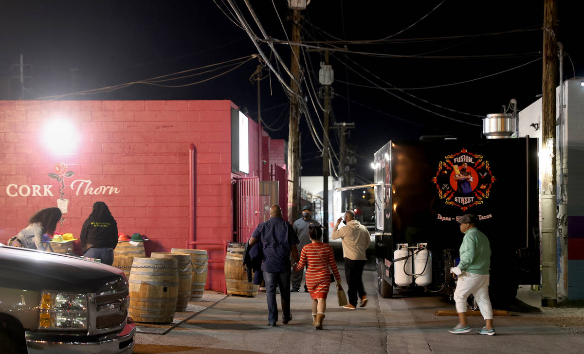 People arrive on reopening night at Cork and Thorn in downtown Las Vegas Sunday, March 21, 2021 ...