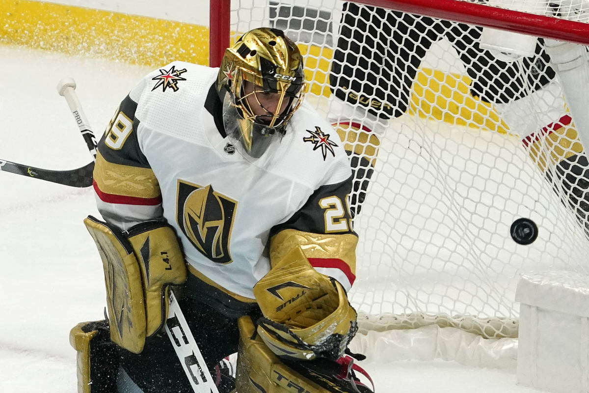 Vegas Golden Knights goaltender Marc-Andre Fleury deflects a shot during the second period of a ...