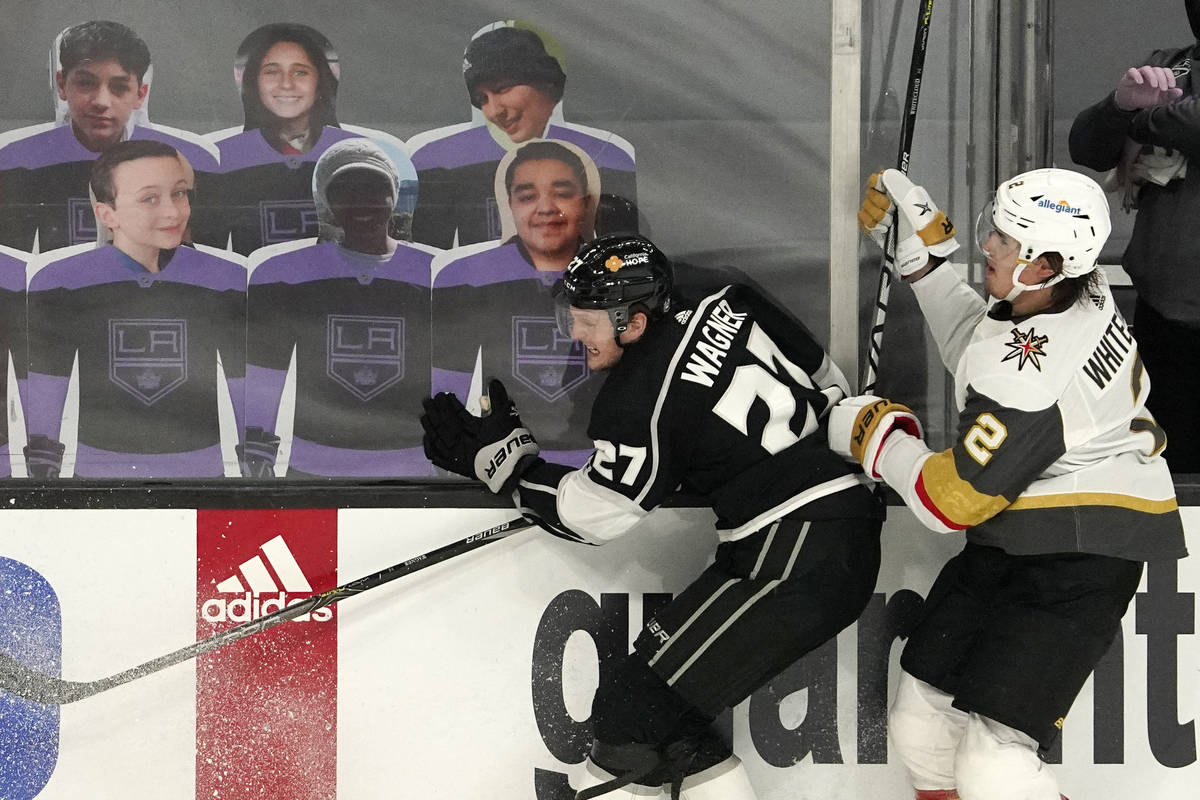 Los Angeles Kings left wing Austin Wagner, left, and Vegas Golden Knights defenseman Zach White ...