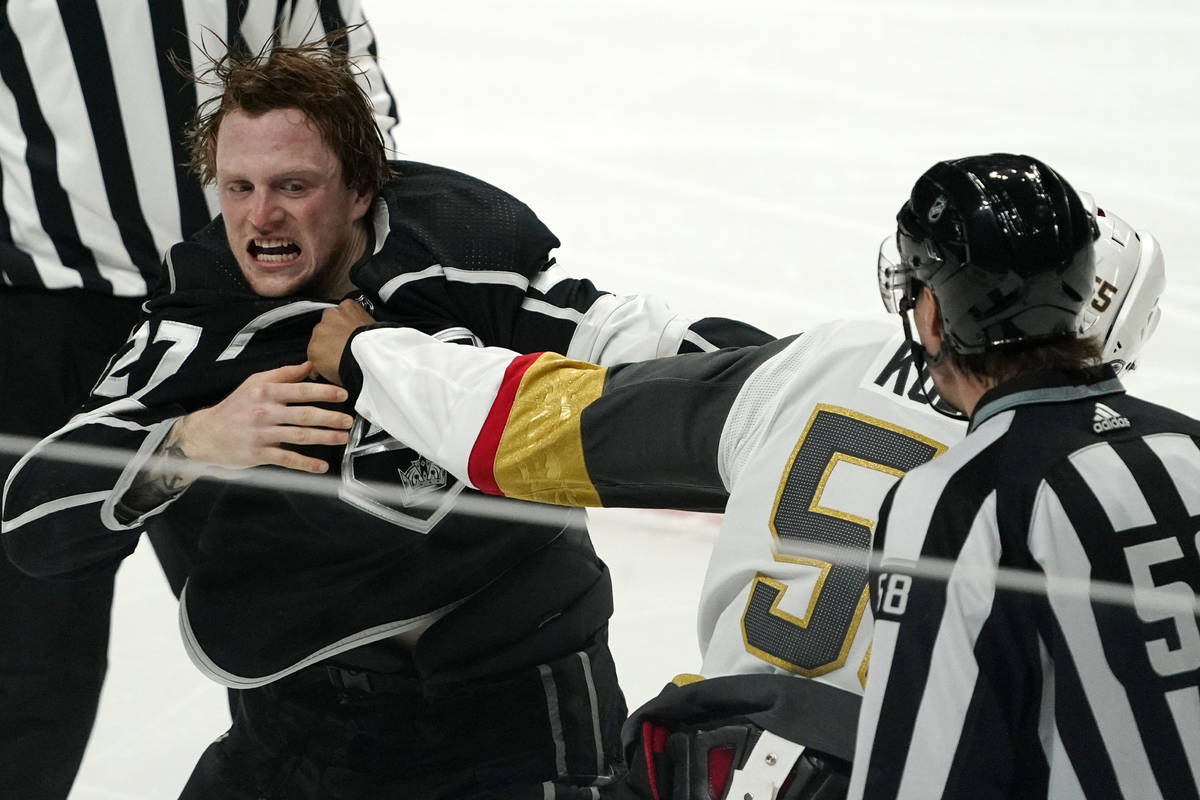 Los Angeles Kings left wing Austin Wagner, left, and Vegas Golden Knights right wing Keegan Kol ...