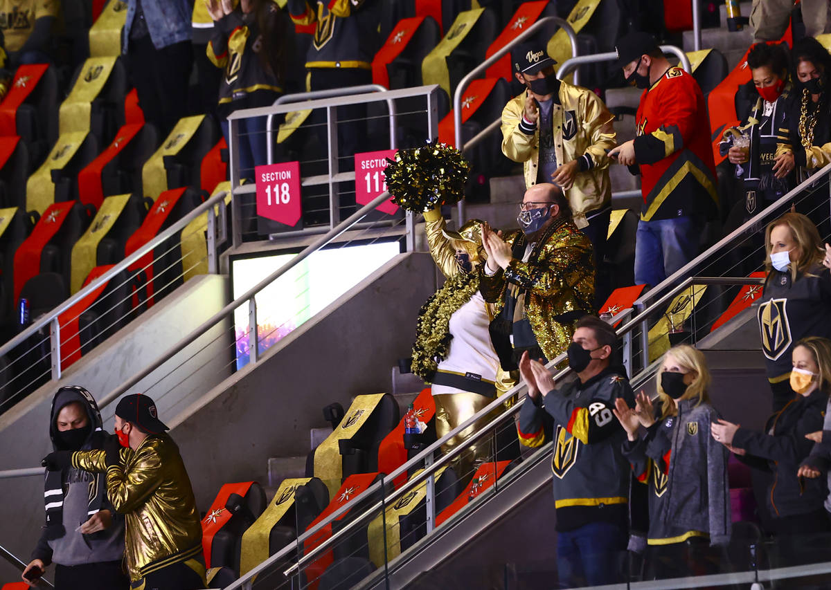 Fans celebrate after the Golden Knights defeated the St. Louis Blues in an NHL hockey game at T ...