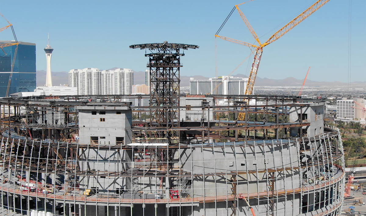 The 170-ton central compression ring sits on top of a 285-foot, 677-ton steel shoring tower at ...