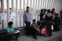 In this Sept. 13, 2019, file photo, Central American migrants wait to see if their number will ...