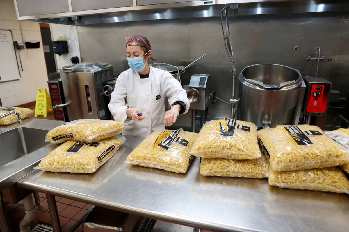 Sous-chef Nila Samano prepares food for Meals on Wheels at Catholic Charities of Southern Nevad ...