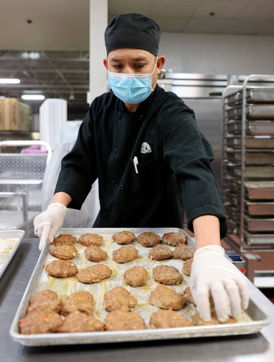 Executive Chef Jun Lao prepares food for Meals on Wheels at Catholic Charities of Southern Neva ...