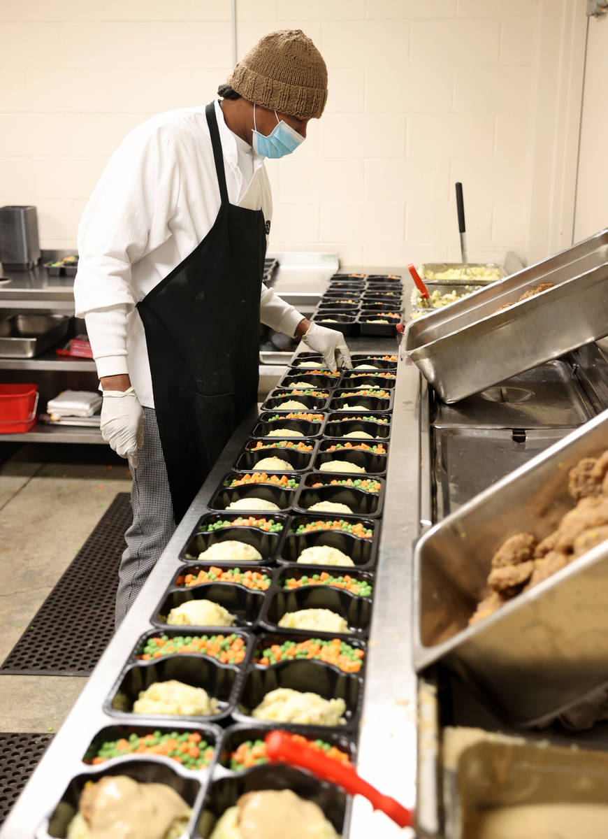 Quincy McGee prepares food for Meals on Wheels at Catholic Charities of Southern Nevada in Las ...