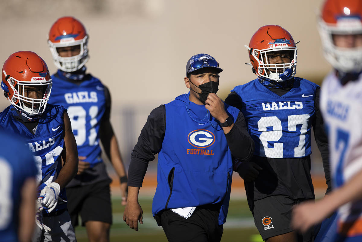 Bishop Gorman head football coach Brent Browner, middle, leads practice on Friday, Feb. 19, 202 ...