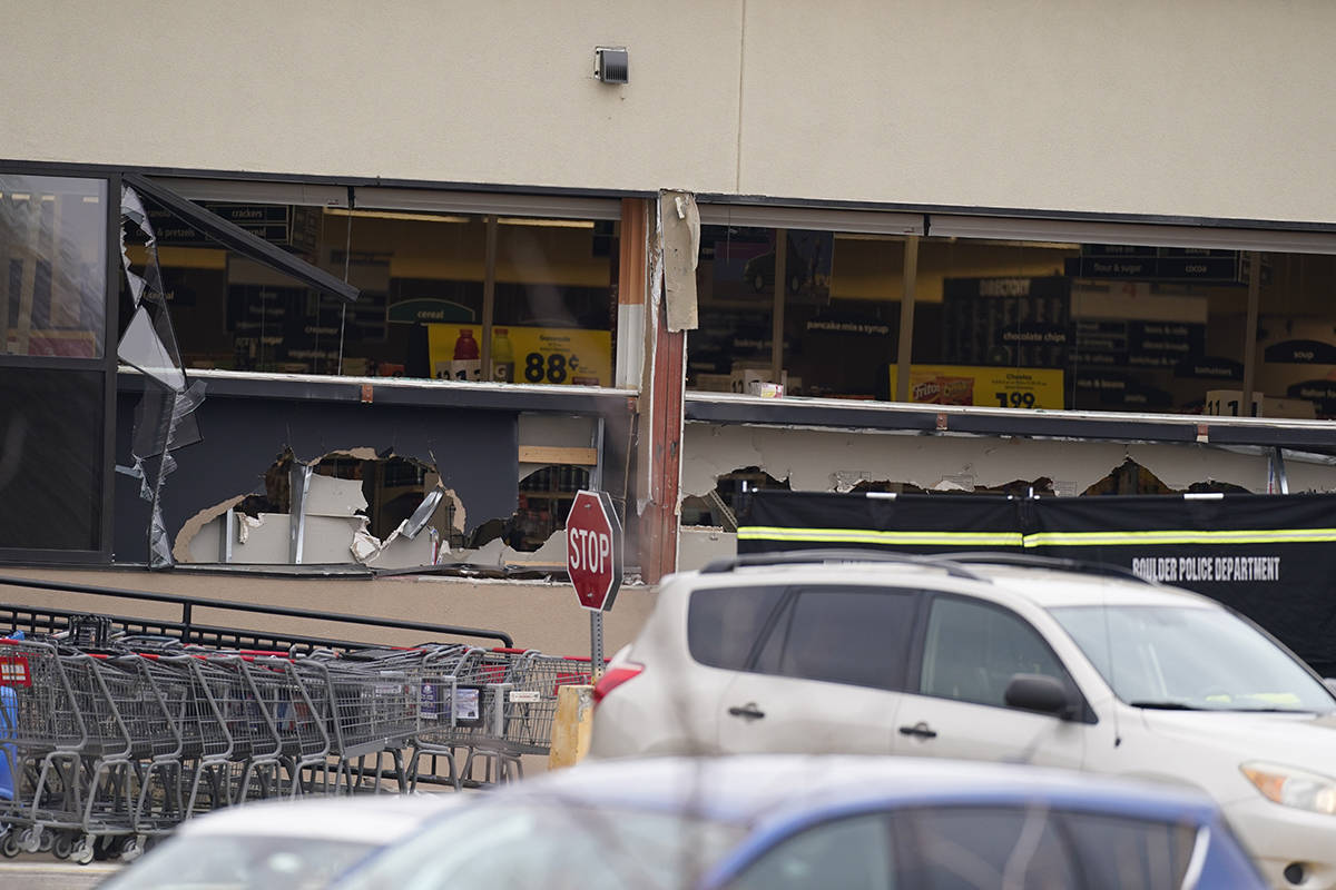 Windows appear damaged at a King Soopers grocery store where a shooting took place Monday, Marc ...