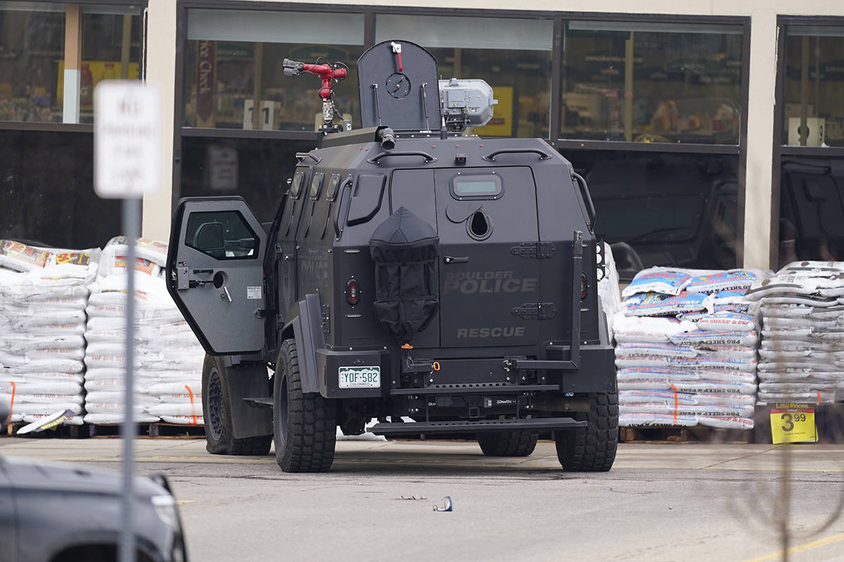 Police work on the scene outside of a King Soopers grocery store where a shooting took place Mo ...