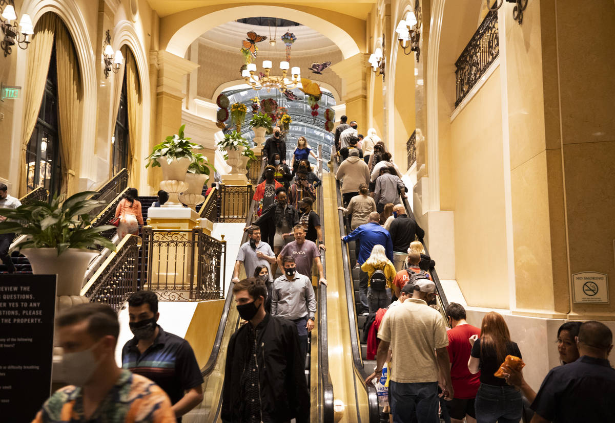 The entrance to the Bellagio is packed on March 19 as March Madness, spring break and St. Patri ...