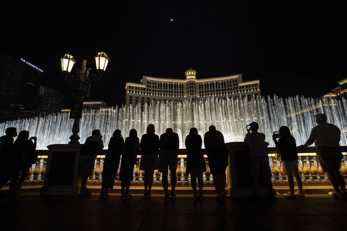 People enjoy the Fountains of Bellagio on March 19, as March Madness and the return of more sho ...