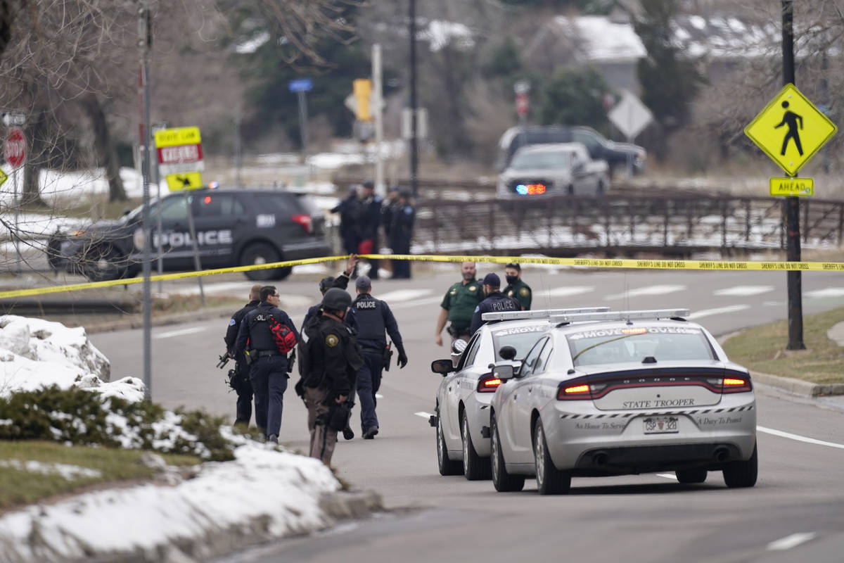 Police work on the scene near a King Soopers grocery store where a shooting took place Monday, ...