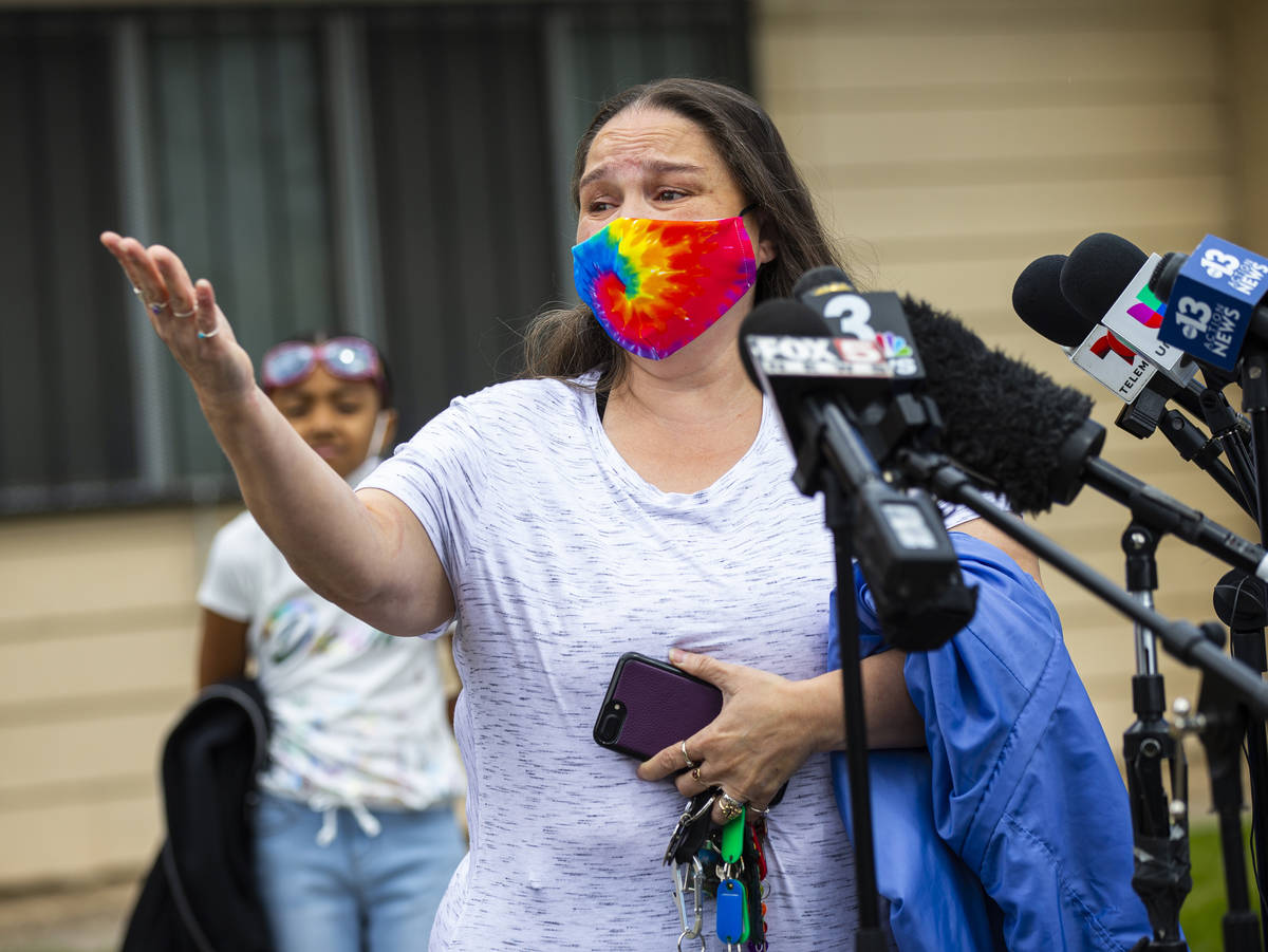 Lynn Armstrong thanks the firefighters that helped assist her and her grandchildren in an apart ...