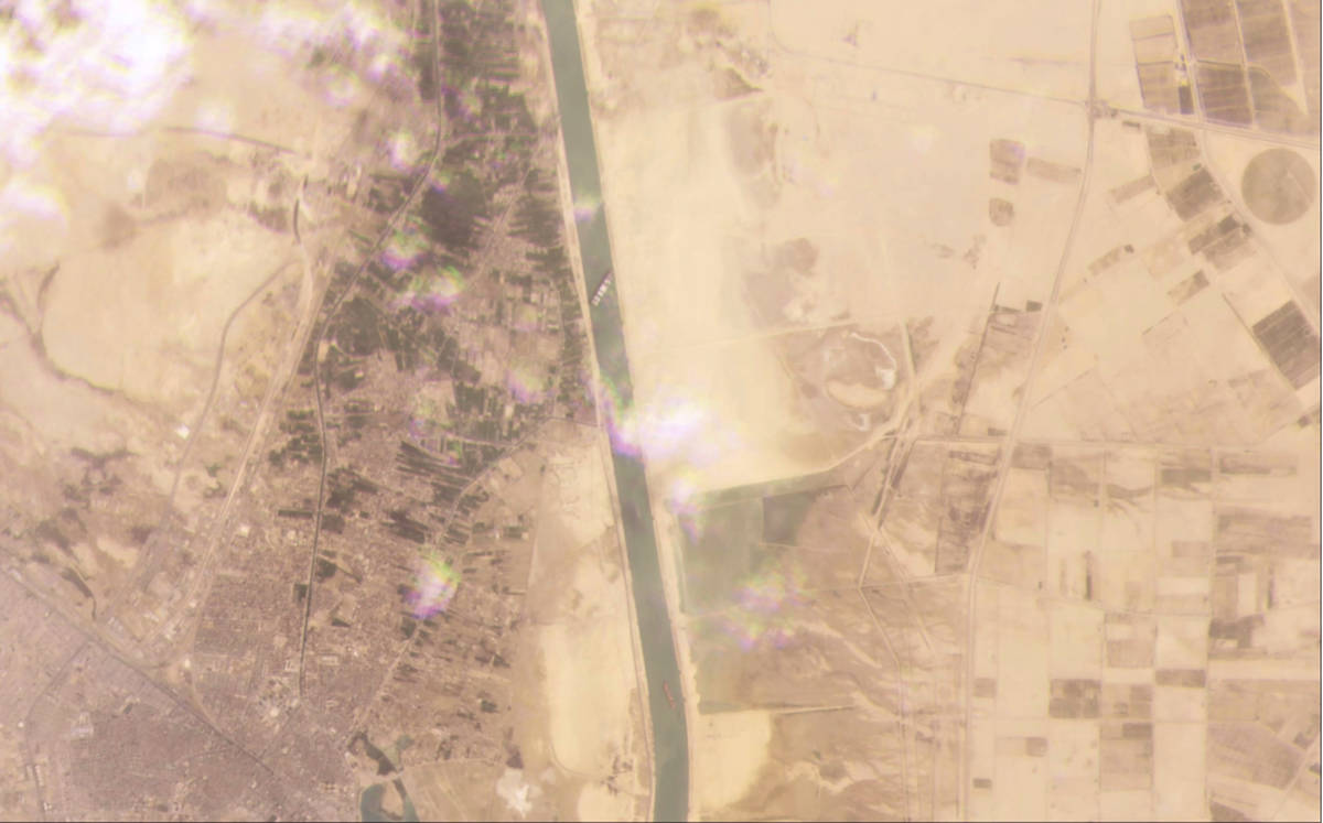 This satellite image from Planet Labs Inc. shows the cargo ship MV Ever Given stuck in the Suez ...